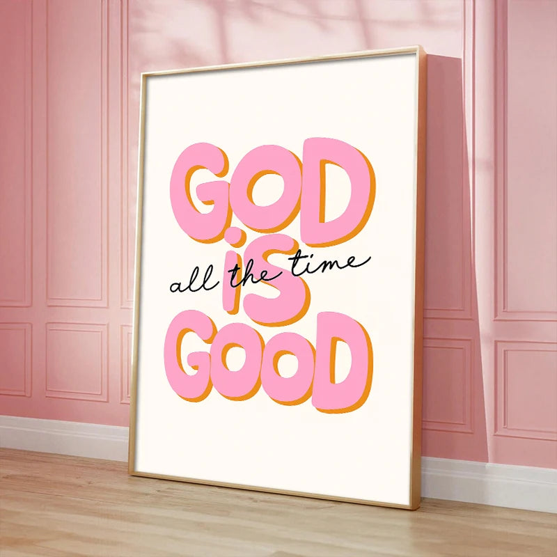 Pink and orange text on a white canvas print reads God is good all the time