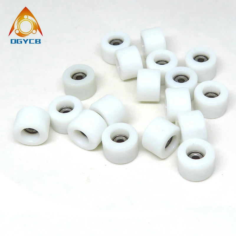 A collection of white PU coated fingerboard wheels with precision bearings.