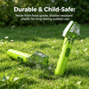 A lime green bug catcher and magnifying viewer is shown lying on green grass.
