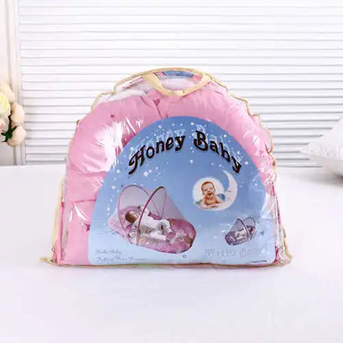 Pink foldable baby mosquito net with mattress and pillow featuring a Honey Baby design