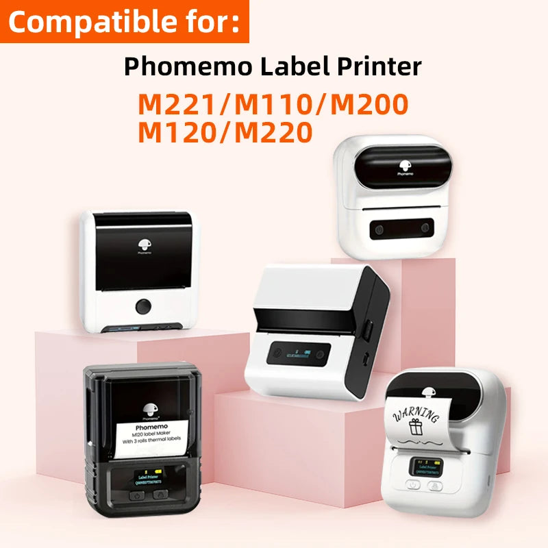 A white Phomemo label printer and related accessories are displayed on a pink background.
