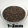A clear bowl filled with black and orange decorative stone pebbles measuring 1-2mm.