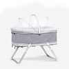 A light gray universal mosquito net cover for a baby stroller or crib, supported by a metal frame.