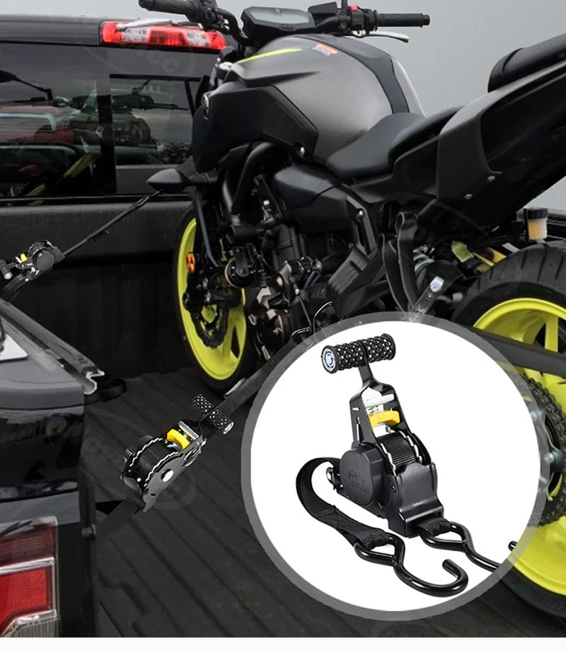 Close-up of heavy duty retractable ratchet straps with yellow and black components on a motorcycle.