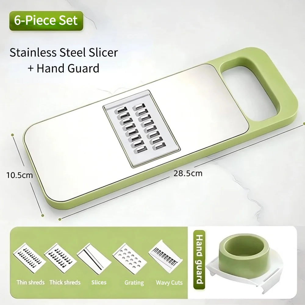 A stainless steel slicer set with a hand guard and five interchangeable blades shown on a light green cutting board.
