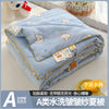 A lightweight summer quilt with a playful cartoon print featuring small bear motifs in light blue.