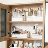 A wooden mirror cabinet with a retractable design showing various cosmetic storage boxes and compartments.