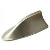 A silver shark fin car antenna with FM/AM signal enhancement.