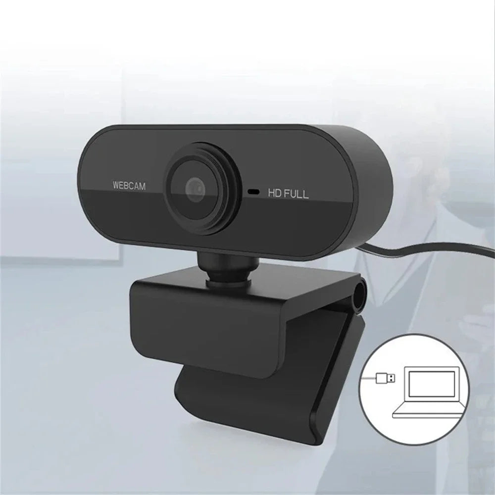 Eine schwarze HD-Webcam mit flexiblem Kabel neben einem Laptop.