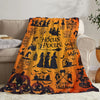 Orange Halloween themed flannel throw blanket featuring spooky designs for cozy decor