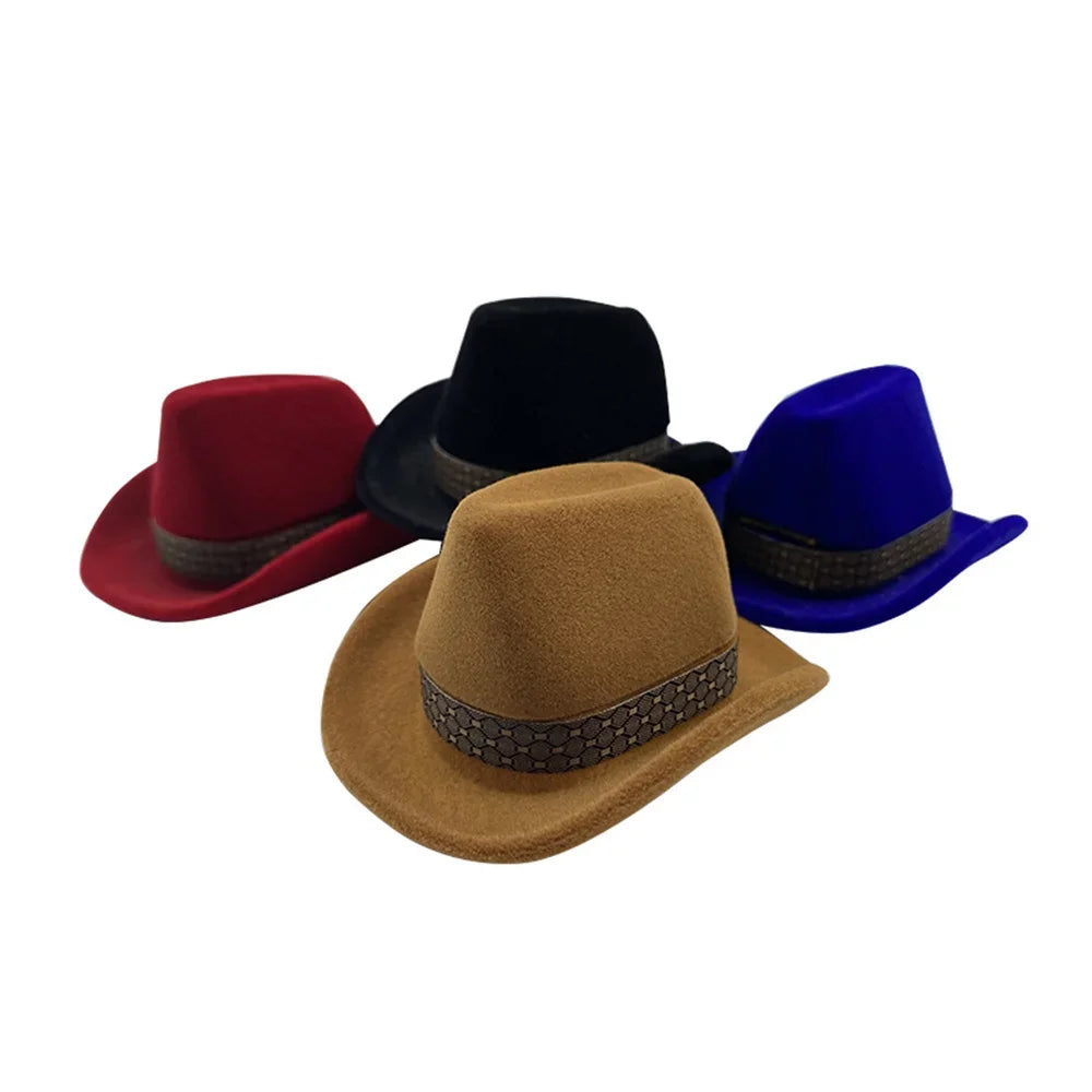 A collection of velvet cowboy hats in red, black, and blue displayed together.