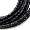 A close-up of black braided leather cord for jewelry making coiled together.