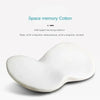 A white memory foam cushion for a car seat, showing its smooth, contoured shape.