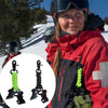 A person wearing a red jacket is holding a green braided paracord work glove clip with a carabiner.