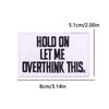 A rectangular black embroidered patch with white text that reads HOLD ON LET ME OVERTHINK THIS.