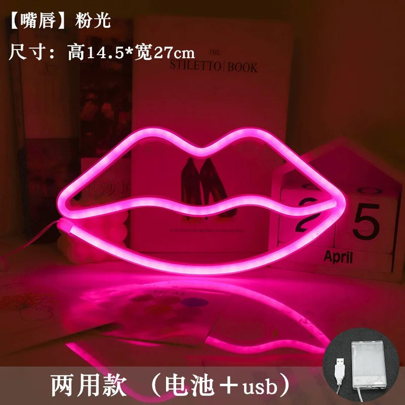 A pink LED lip neon sign shaped like lips, illuminated on a surface.
