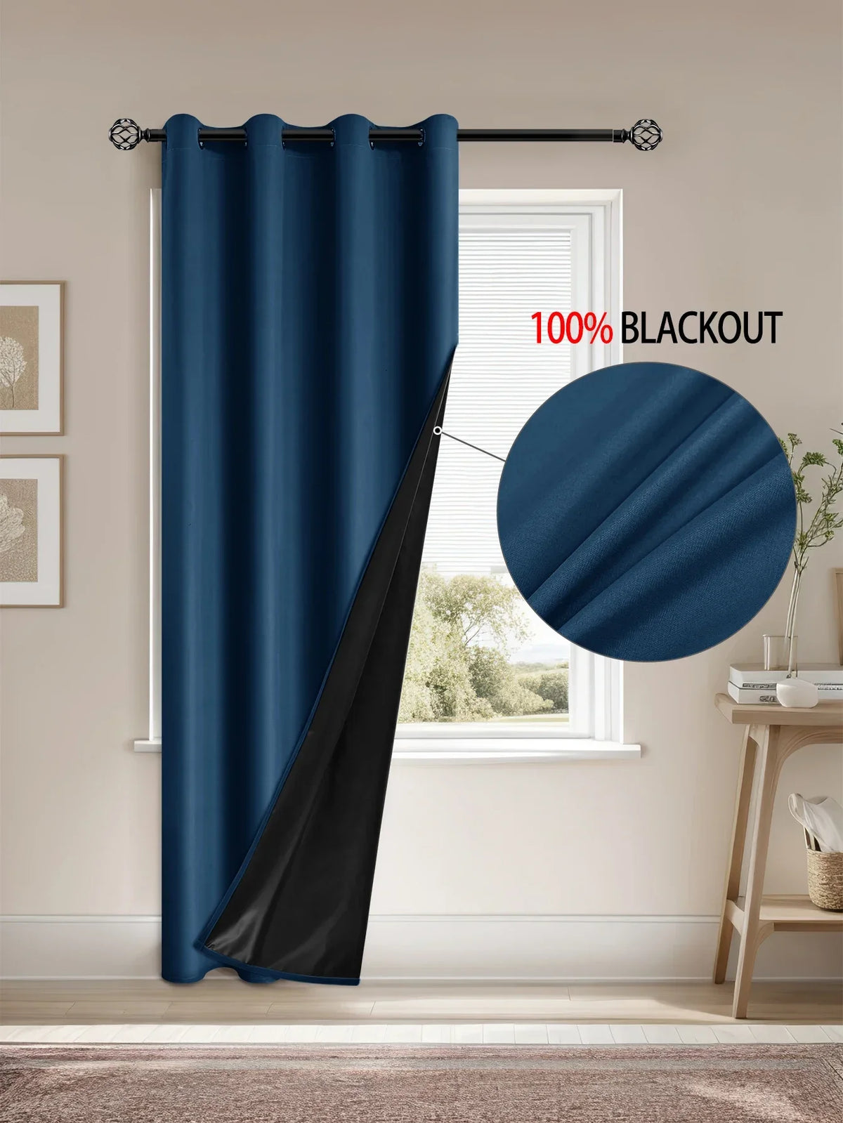 A dark blue blackout curtain hanging in a window frame, showing its full drape and black lining.