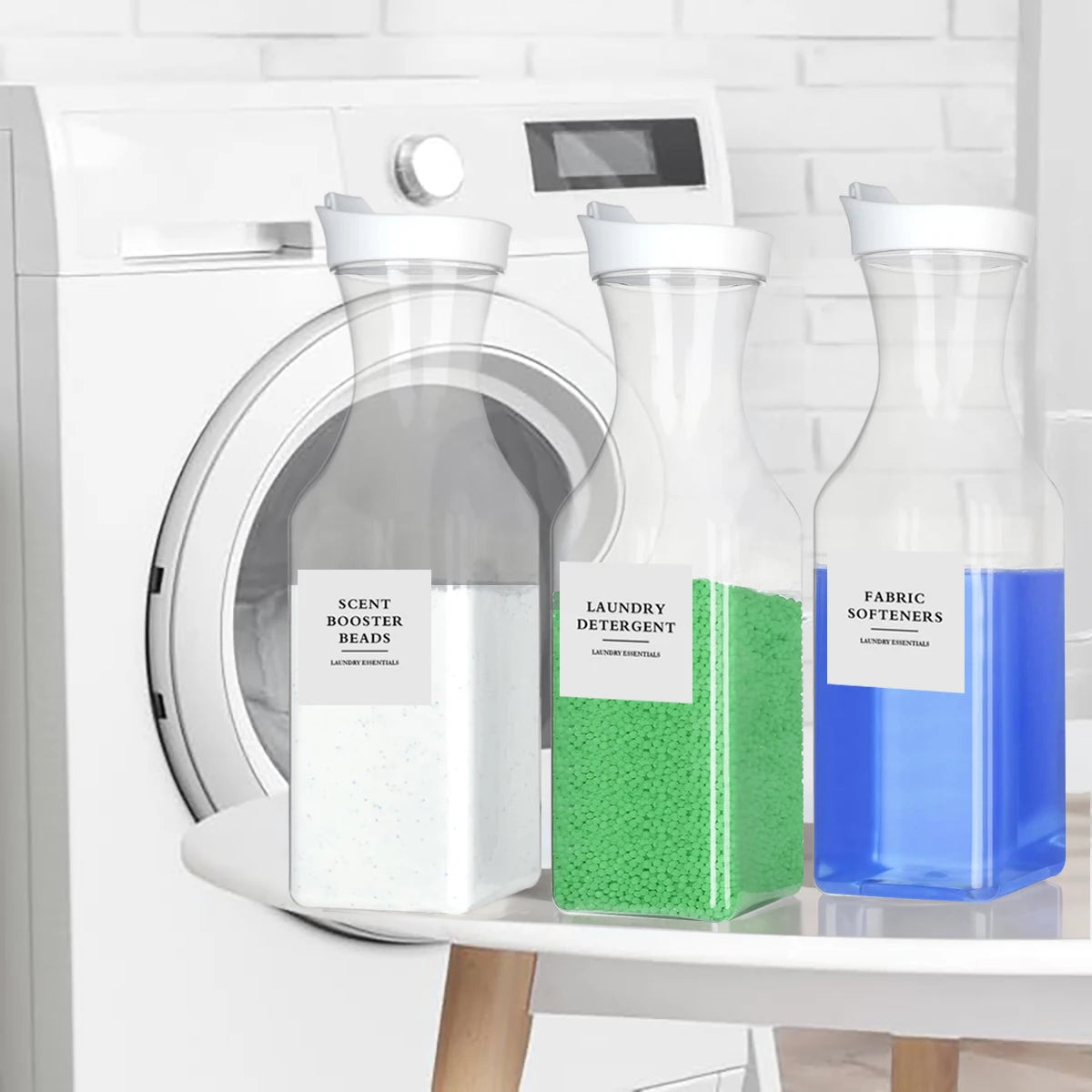 Three refillable glass bottles of laundry detergent with white and green labels sitting on a white shelf.