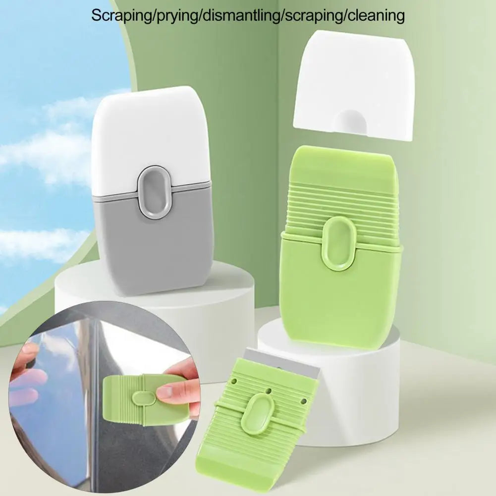 A white and lime green double-ended cleaning scraper with a protective cover is shown alongside its disassembled parts.