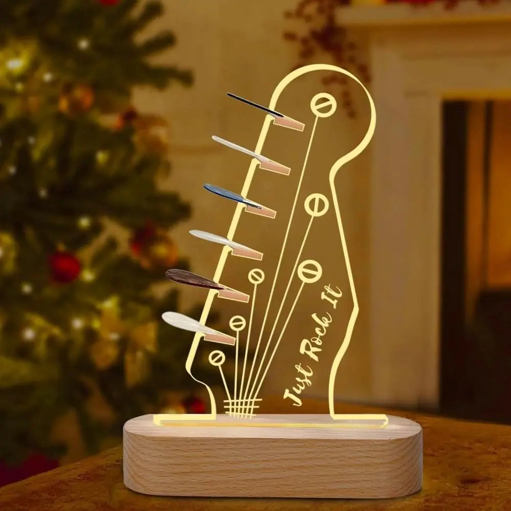 Illuminated acrylic guitar pick holder with a wooden base featuring a guitar outline and the text Just Rock It
