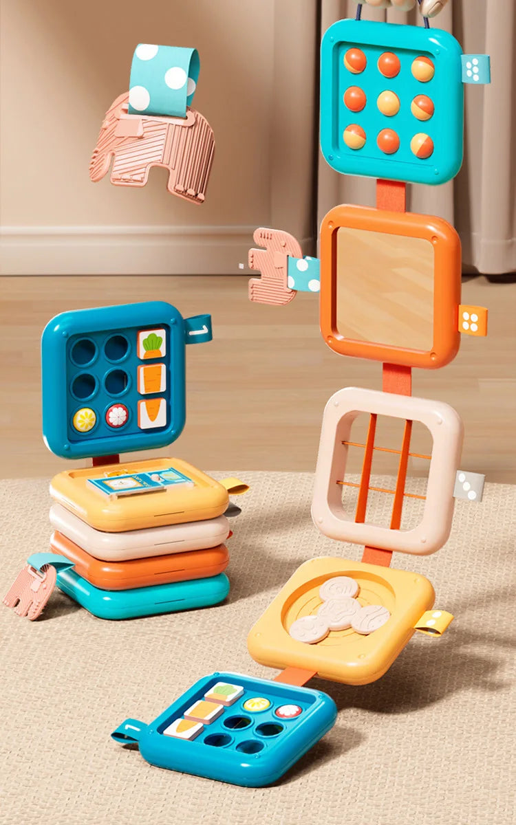 A colorful sensory folding activity cube for toddlers featuring various colored squares and shapes designed for fine motor sk