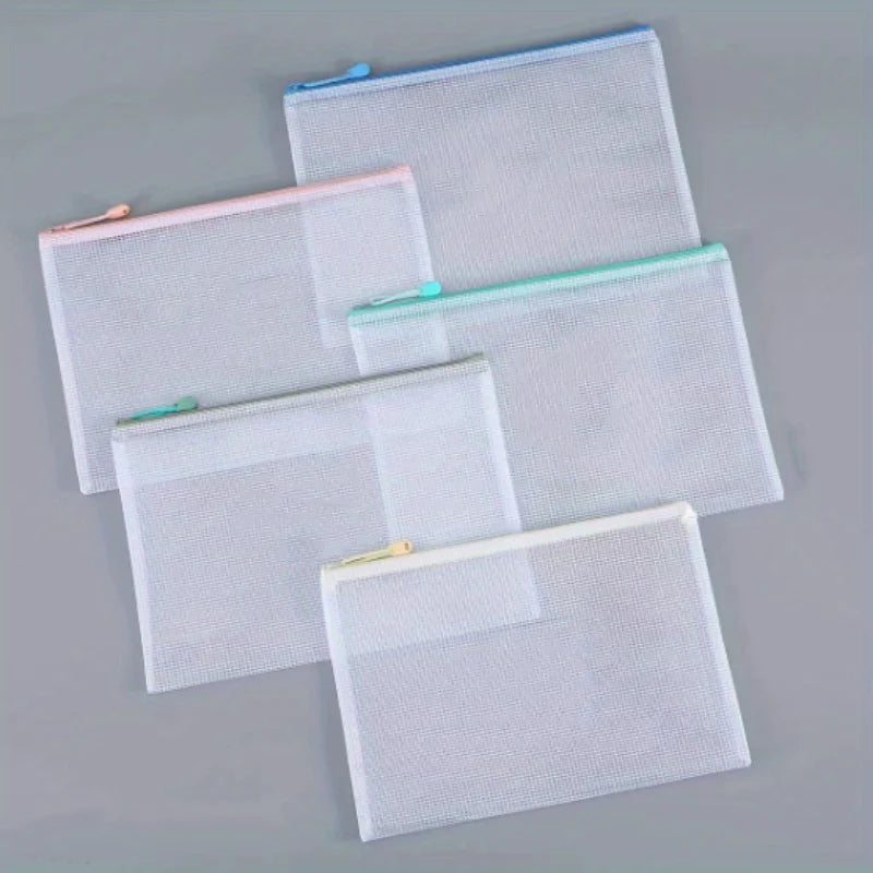 A set of ten white mesh zipper bags for classroom and craft organization