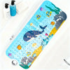 A bright blue bathtub mat featuring a cartoon whale and various sea creatures with suction cups.