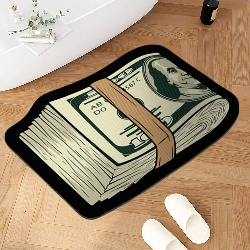 A black non-slip bathroom rug featuring a print of US dollar bills and a portrait of a historical figure on a wooden floor.