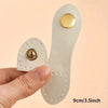 A set of eight light beige leather buckle clasps with gold accents shown being held by a hand.