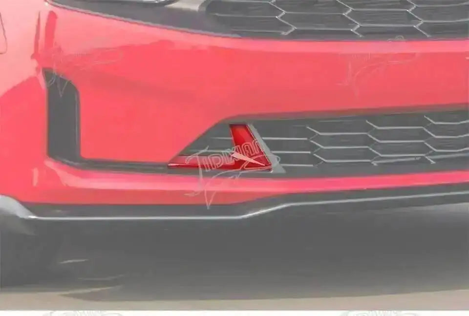 Close-up of a red front fascia trim kit for a Chevrolet Camaro vehicle.