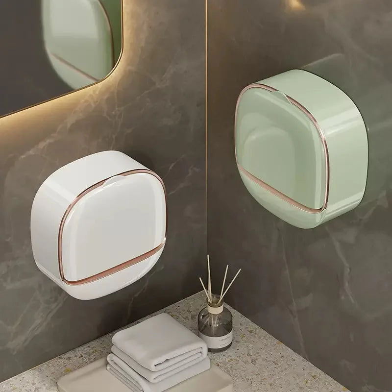 A white waterproof hanging soap holder with a drainage feature mounted on a gray marble wall.