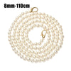 A strand of small, round, cream-colored pearls on a gold-toned chain for bags or purses.
