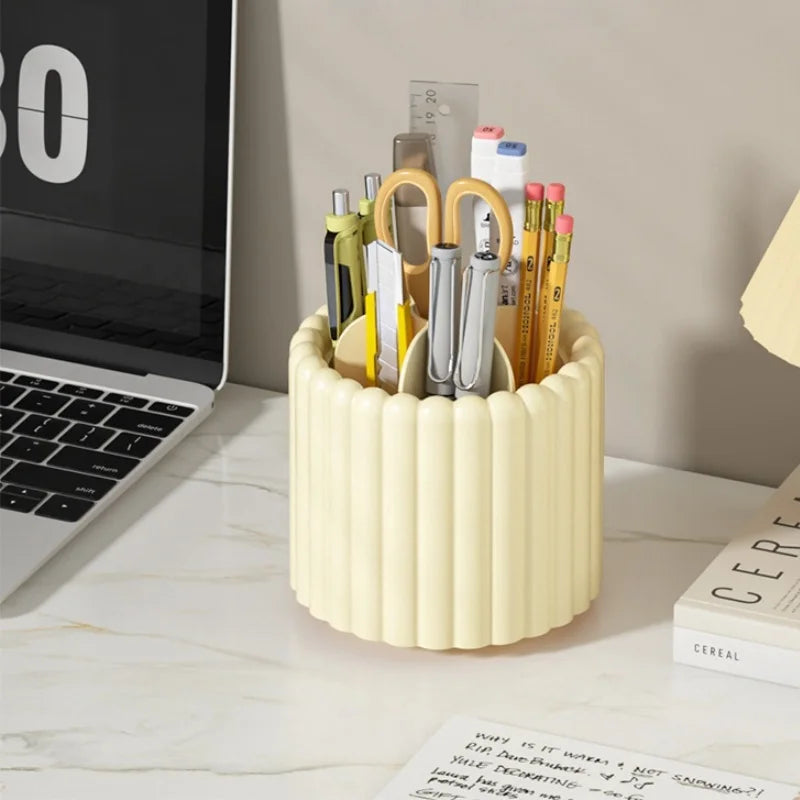 A light beige rotating organizer holds several makeup brushes and tools for organization.
