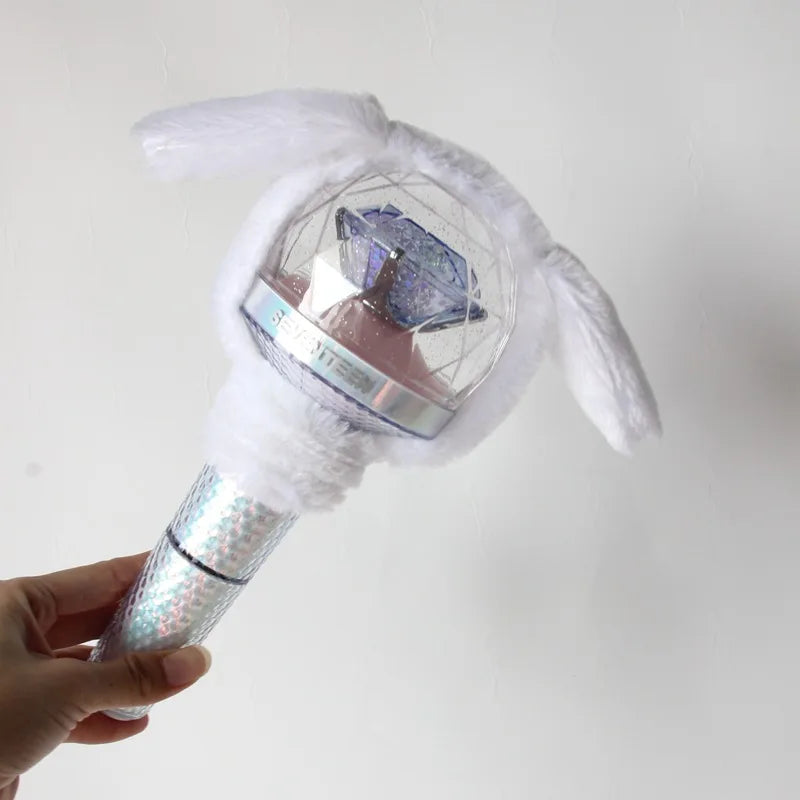 A white plush cover shaped like a light stick, featuring a clear sphere with a blue design.