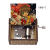 A music box featuring Cardcaptor Sakura characters, including Sakura Kin, with a hand crank mechanism.