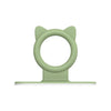 A light green silicone toilet lid lifter with a self-adhesive hook.
