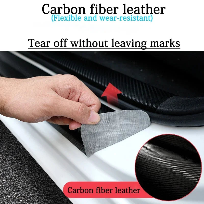 A hand is tearing off a carbon fiber leather door sill protector, showing the texture of the material.