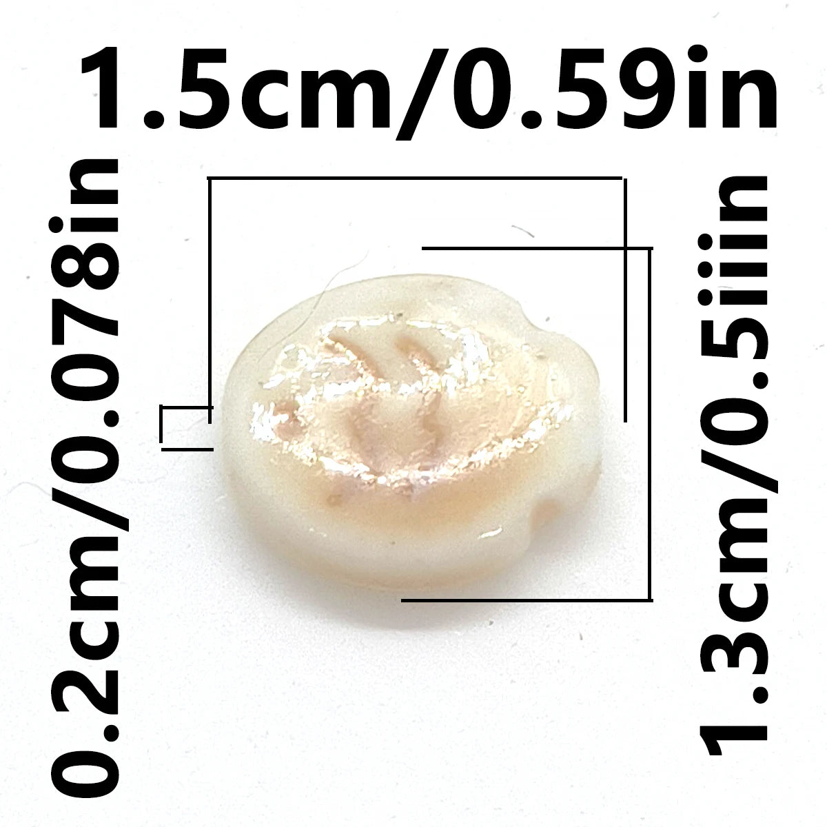 A small, oval-shaped ceramic fish bead with a light, translucent color.
