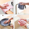 Hands are shown using reusable microfiber cleaning towels to wipe a sink and a stovetop.