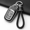 A black anti-scratch TPU protective case for a Honda key fob, featuring a metal split ring attachment.