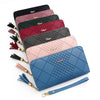 A stack of nine colored PU leather wristlet clutch wallets with gold chain accents.