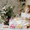 Clear transparent PVC gift tote bags with hand loops displayed on a white table.