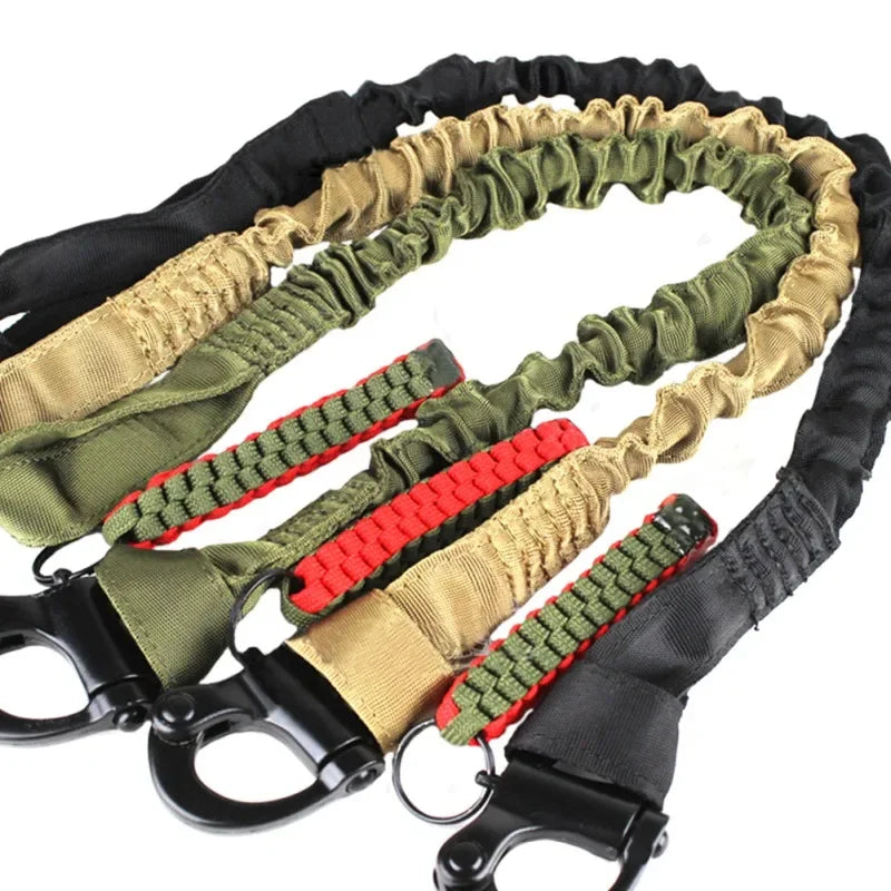 A set of black and olive green quick-release tactical rifle slings with shoulder pads