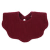 A deep burgundy knitted baby bib in a bandana style with a cutout for the neck.