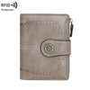 A light taupe leather wallet with multiple card slots and RFID protection features.