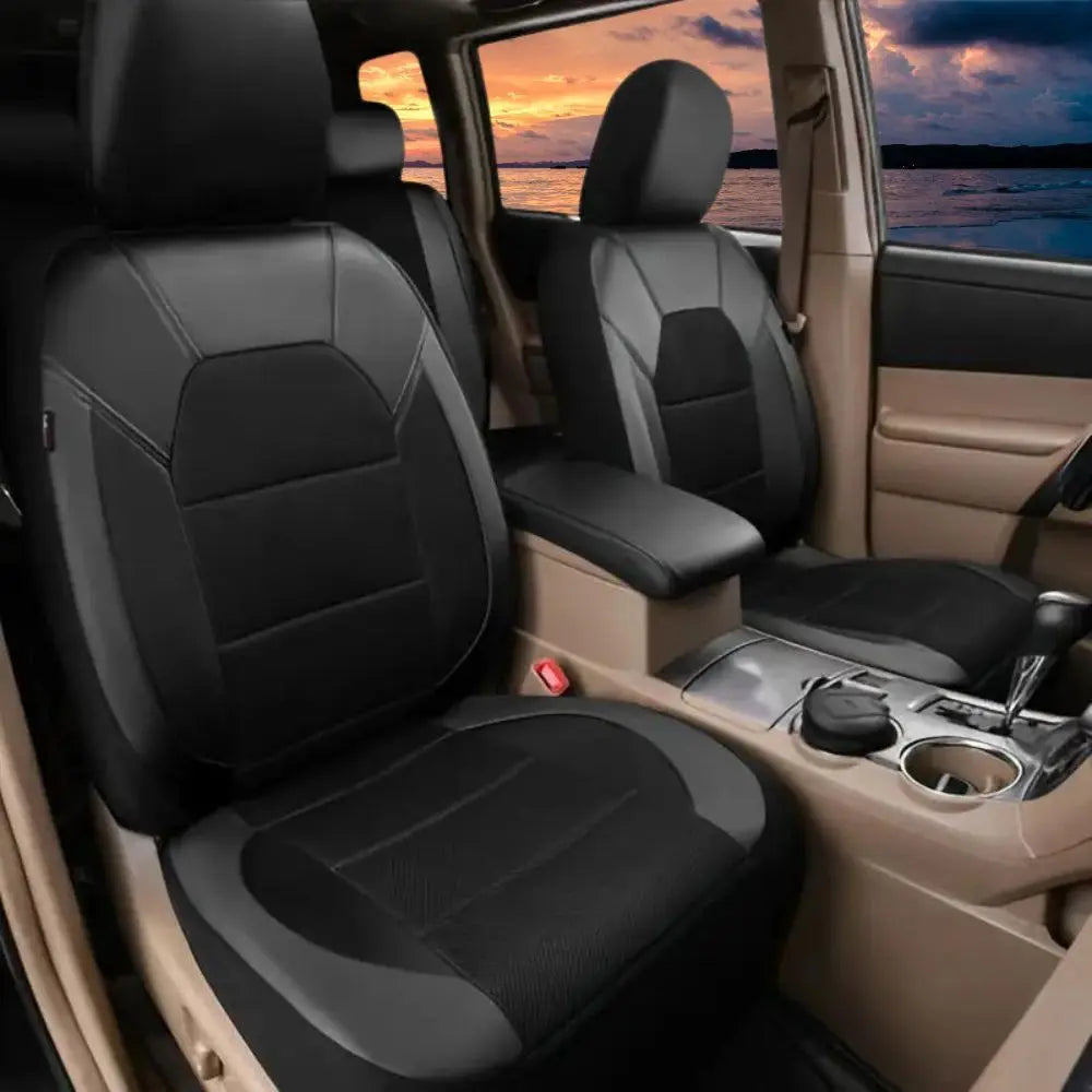 Interior view of a car with black PU leather seat covers and breathable mesh, showing the front passenger seat.