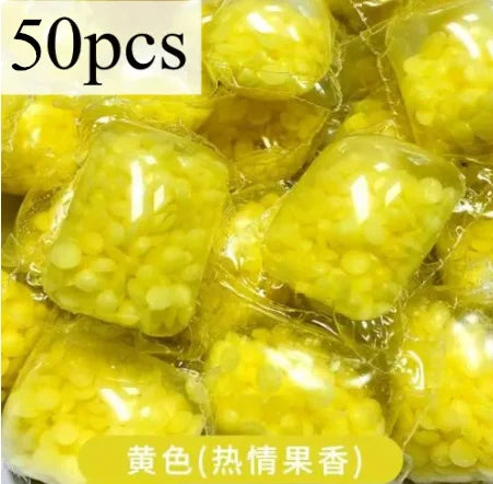 50 pieces of yellow water-soluble laundry fragrance beads packaged in clear plastic.
