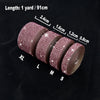 Rolls of crystal rhinestone ribbon stickers in various sizes XL, L, M, S displayed on a dark surface.