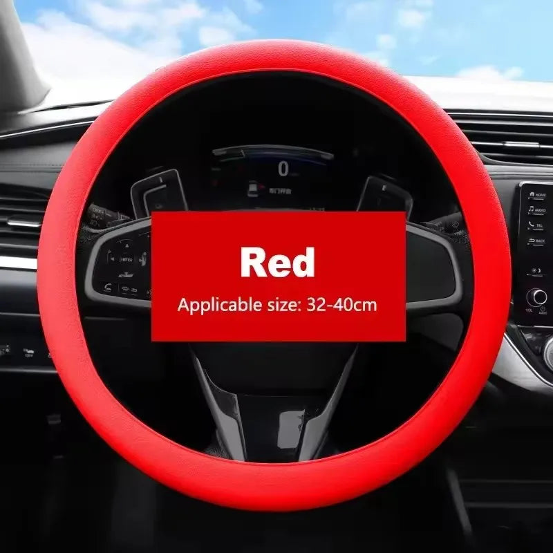 Red silicone steering wheel cover for a car, showing the fit and texture.