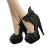 A black, high-heeled shoe accessory for a fashion doll outfit.